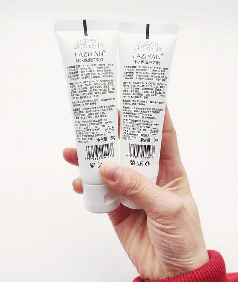 Aloe Vera Face Cream shown in hand, 60g tubes displaying product information and ingredients.